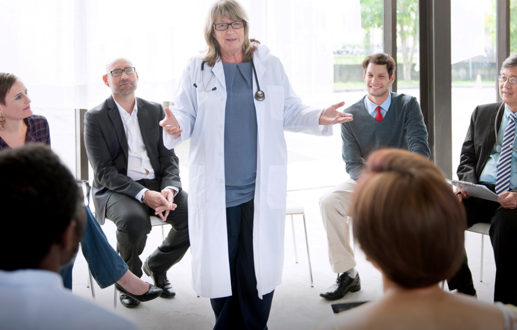 Physician speaking to health system leadership
